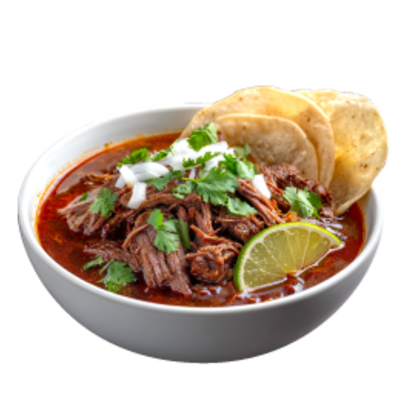 Bowl of red pozole with shredded meat, lime and tostadas